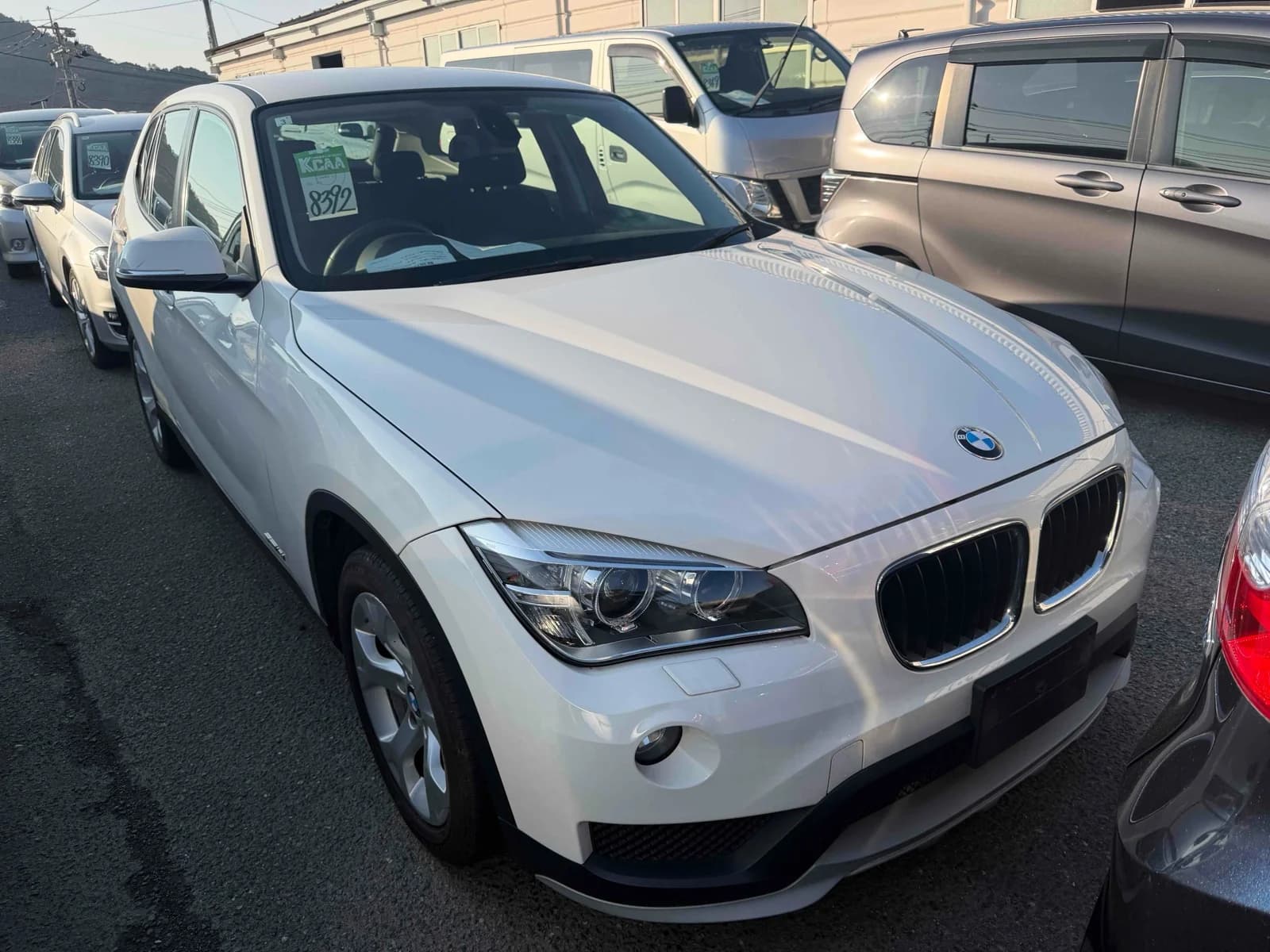 Front-left angle of white BMW X1 compact SUV
