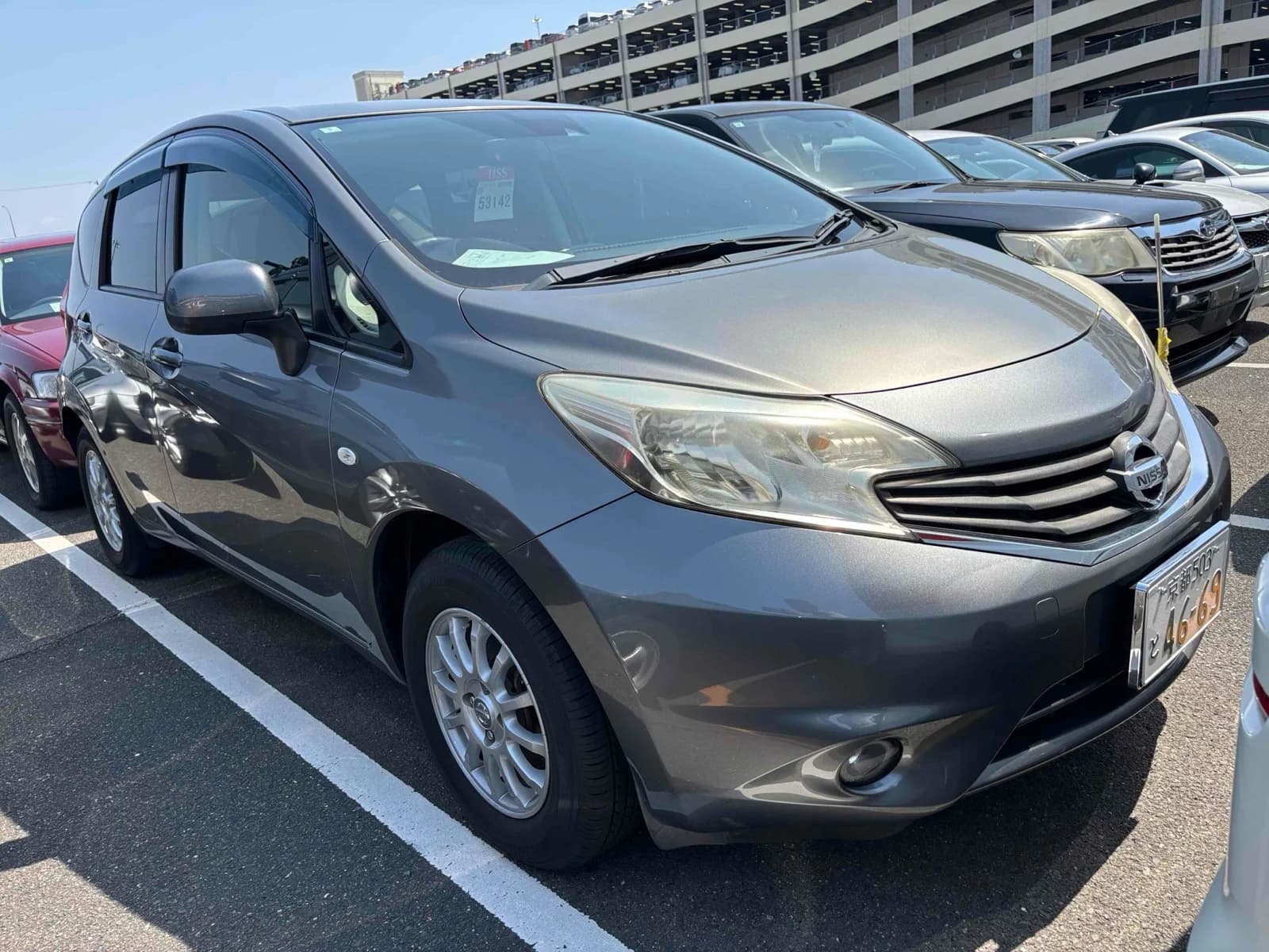 Compact economy sedan front-left three-quarter exterior view