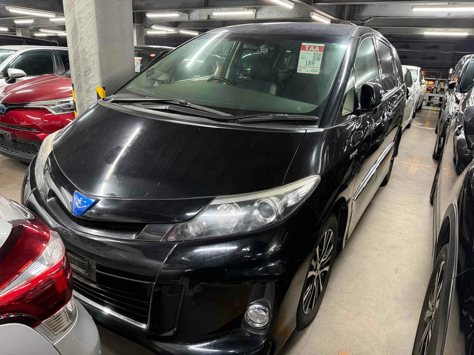Toyota luxury minivan front-left three-quarter exterior view