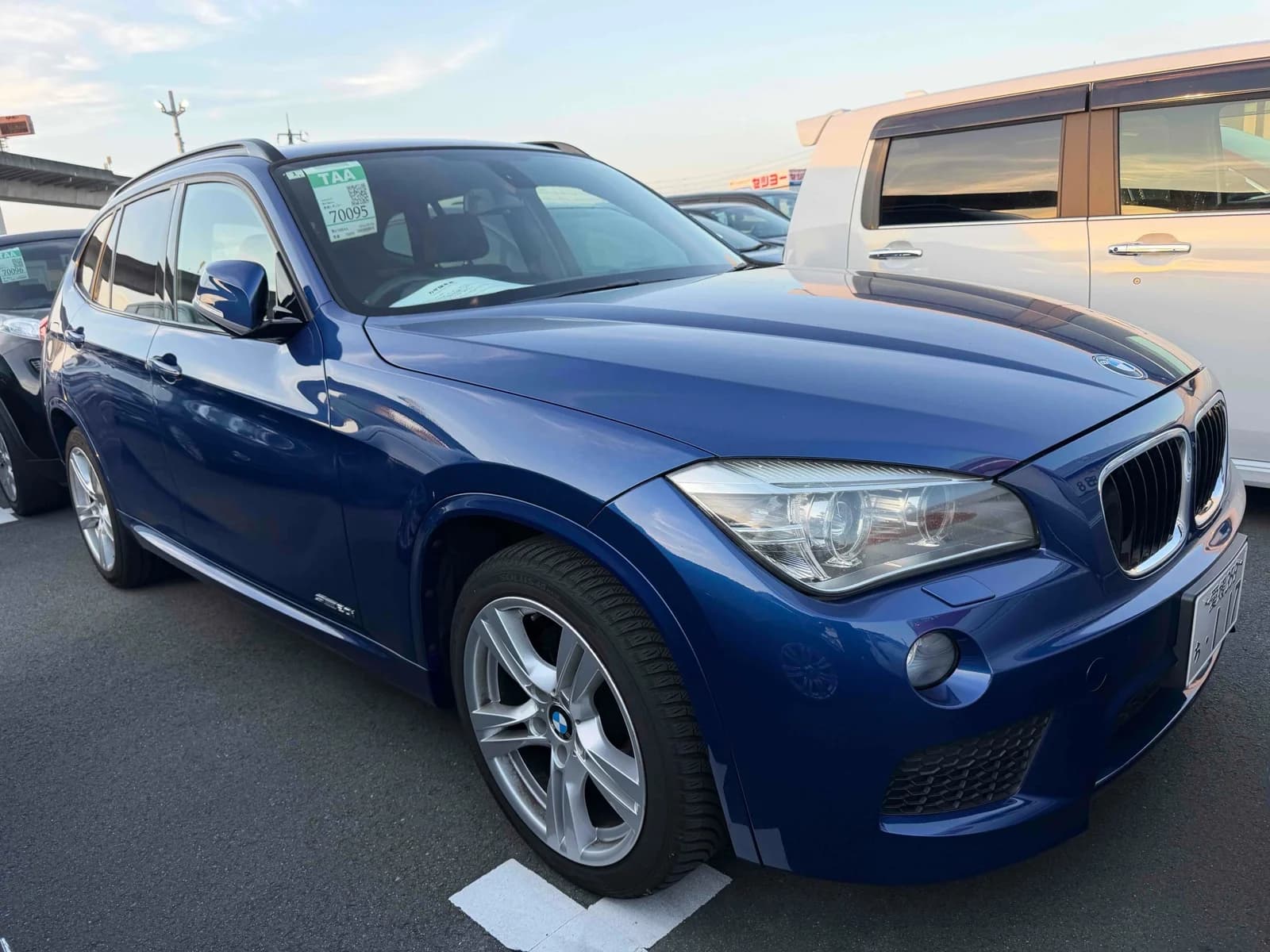 Front-left angle of blue BMW X3 compact SUV