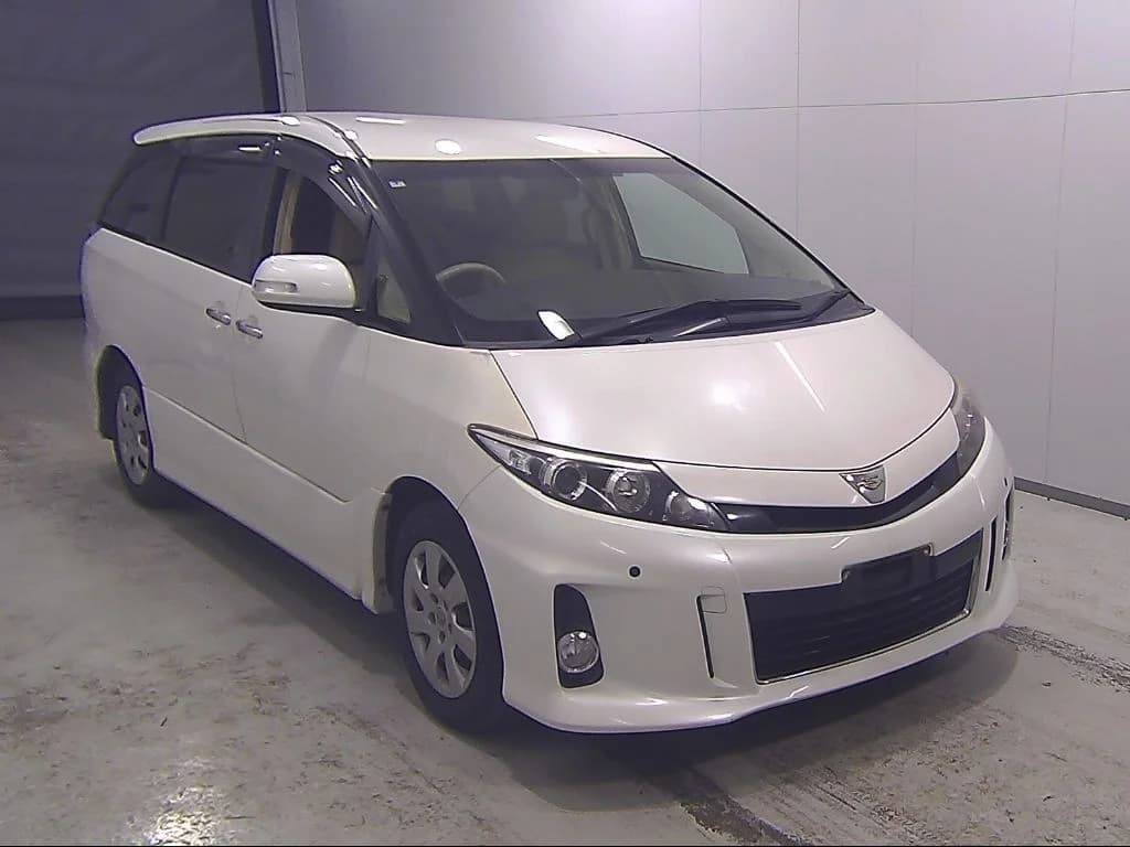 White Toyota Wish compact family MPV front-left three-quarter view at auction facility
