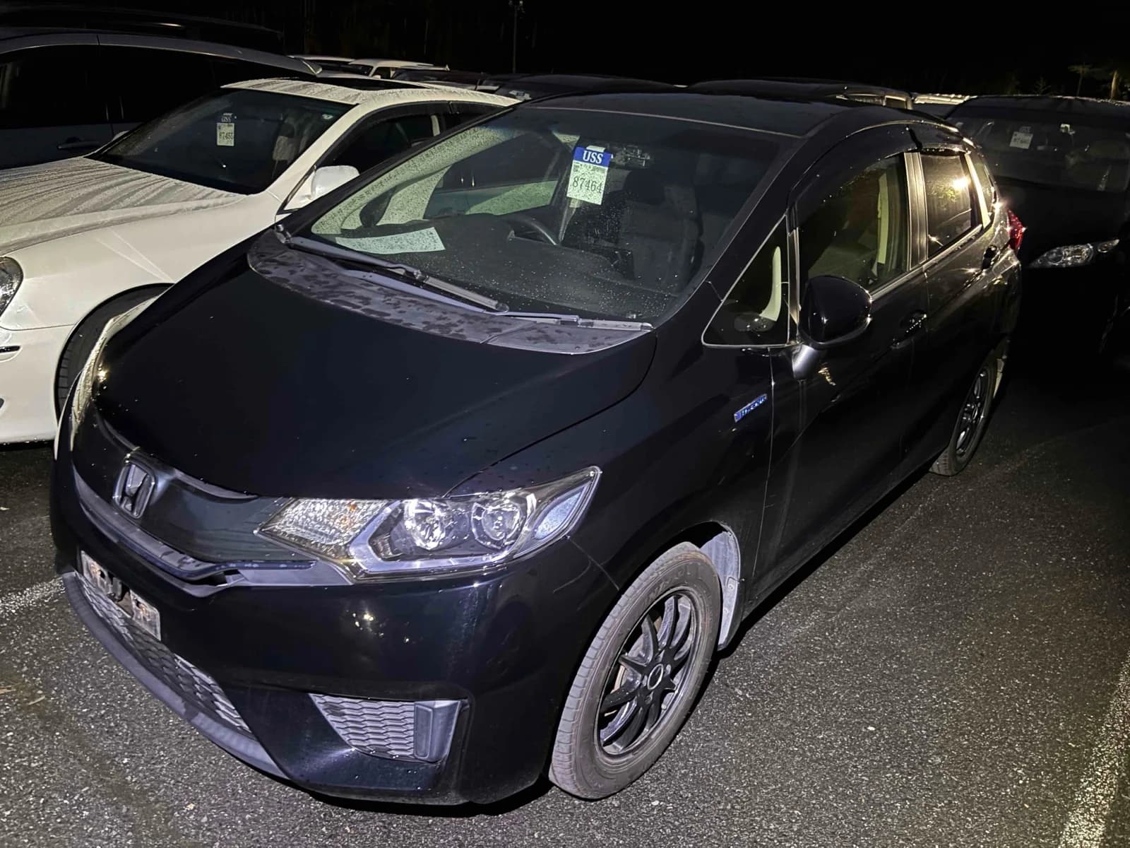 Honda Fit Hybrid - front-left 3/4 exterior with white paint