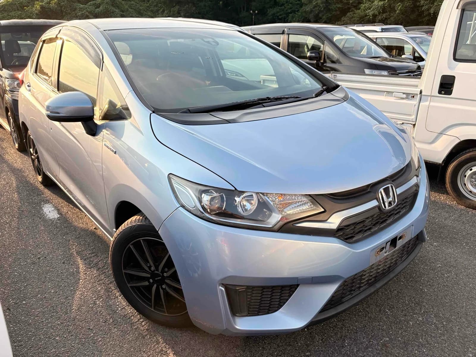 Honda Fit Hybrid - front-left 3/4 exterior with white paint