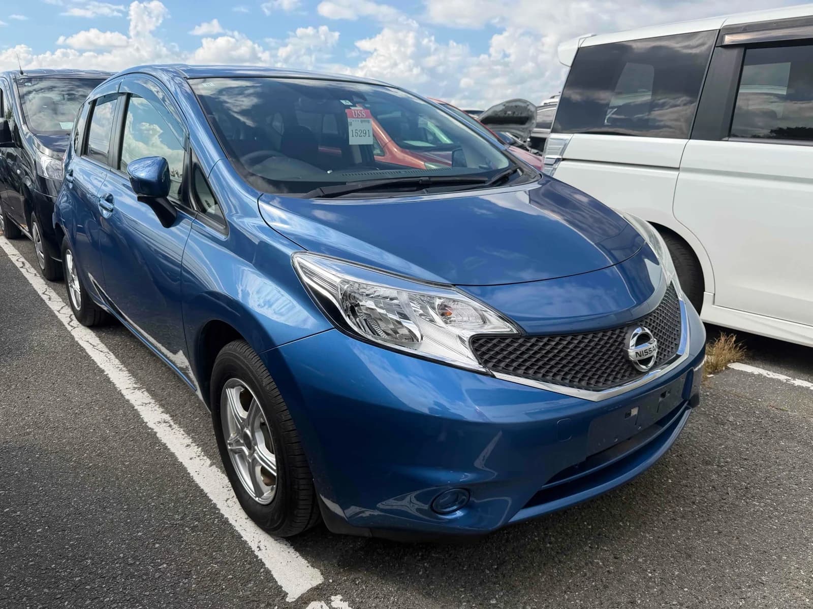 Compact sedan front-left three-quarter view