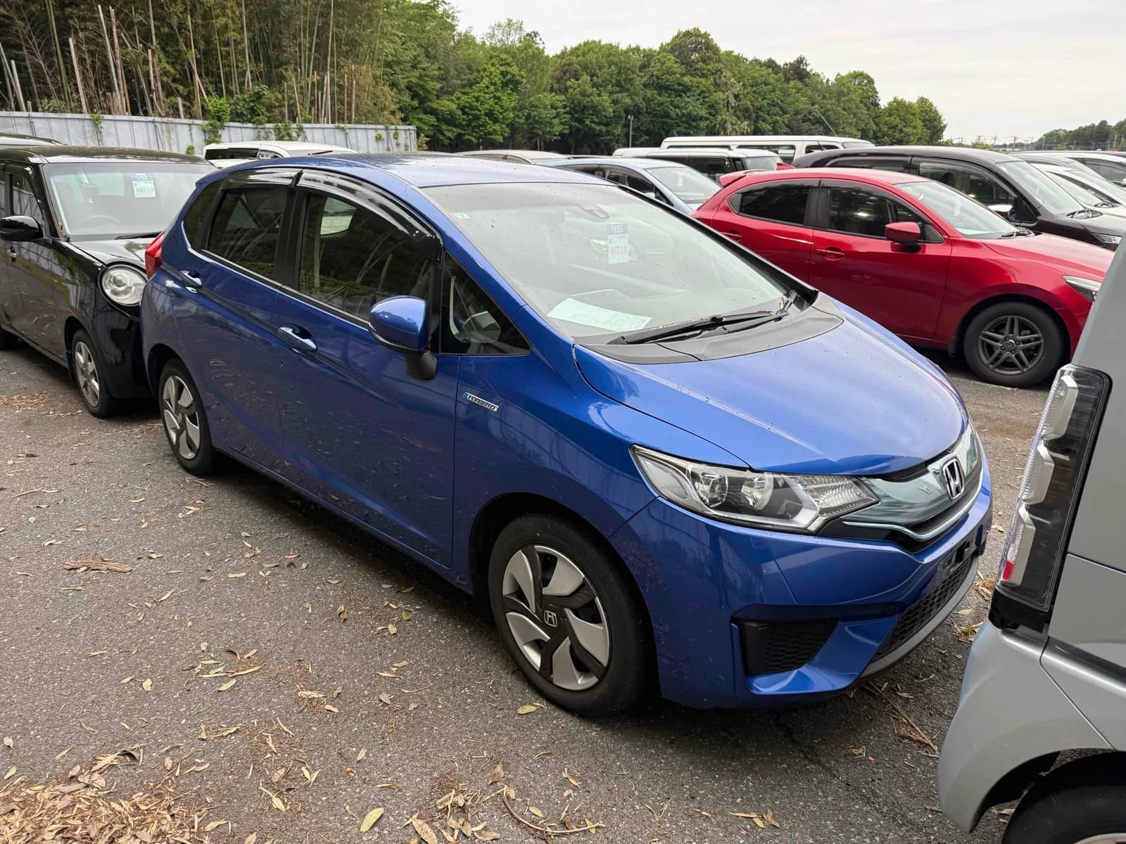 Honda Fit Hybrid - front-left 3/4 exterior with white paint