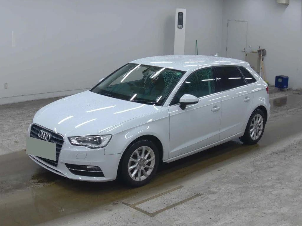 2015 Audi A3 Sportback 1.4 TFSI in white - front-left 3/4 view with xenon headlights, singleframe grille, and 16-inch silver alloy wheels