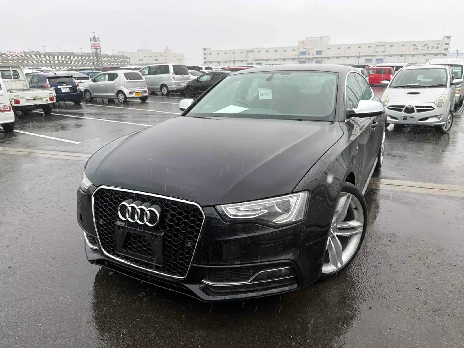 2013 Audi S5 Sportback 3.0 TFSI quattro in black - front-left 3/4 view with RS-style honeycomb grille, xenon LED headlights, and 19-inch alloy wheels