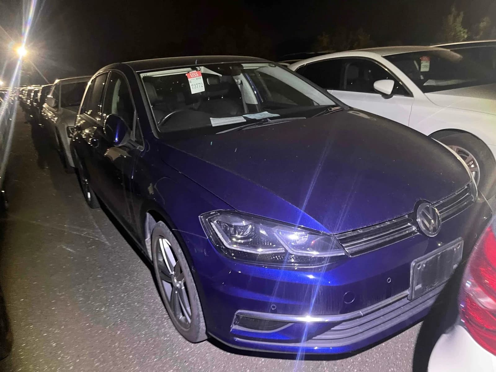 2019 Volkswagen Golf TSI Highline Meister in metallic blue - front-right 3/4 view with LED headlights, chrome grille strips, parking sensors, and grey alloy wheels